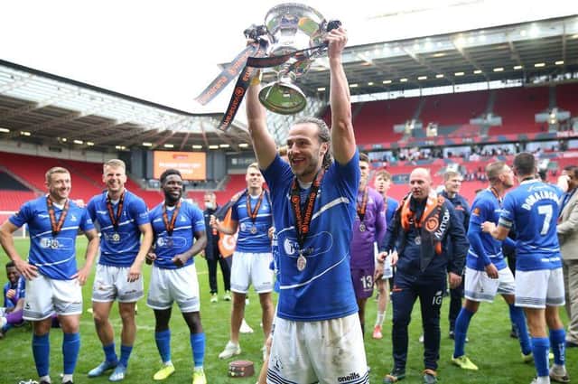 Jamie Sterry lifting the National League promotion final trophy (photo: PA)