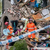 Emergency workers at the scene of a suspected gas explosion, in which a young child was killed and two people were seriously injured, on Mallowdale Ave Heysham which caused 2 houses to collapse and badly damaged another. Picture date: Sunday May 16, 2021.