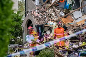 Emergency workers at the scene of a suspected gas explosion, in which a young child was killed and two people were seriously injured, on Mallowdale Ave Heysham which caused 2 houses to collapse and badly damaged another. Picture date: Sunday May 16, 2021.