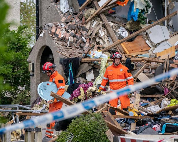 Emergency workers at the scene of a suspected gas explosion, in which a young child was killed and two people were seriously injured, on Mallowdale Ave Heysham which caused 2 houses to collapse and badly damaged another. Picture date: Sunday May 16, 2021.
