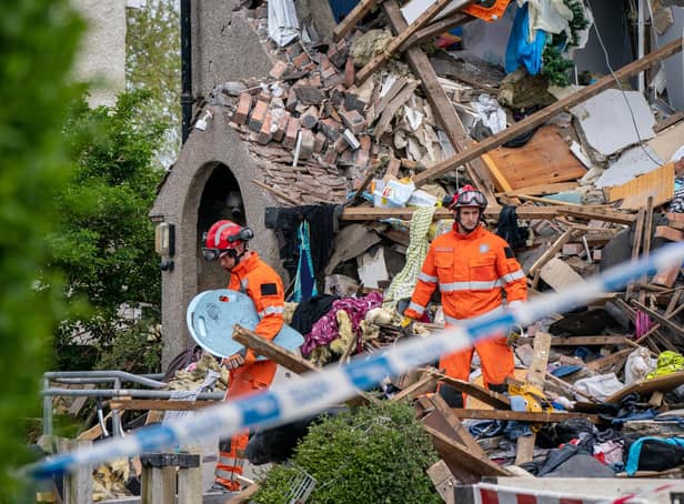 Emergency workers at the scene of a suspected gas explosion, in which a young child was killed and two people were seriously injured, on Mallowdale Ave Heysham which caused 2 houses to collapse and badly damaged another. Picture date: Sunday May 16, 2021.