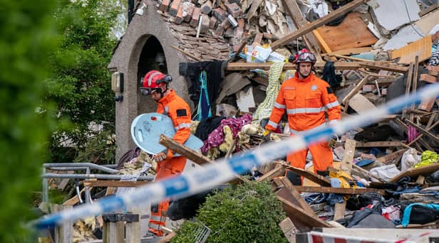 Emergency workers at the scene of a suspected gas explosion, in which a young child was killed and two people were seriously injured, on Mallowdale Ave Heysham which caused 2 houses to collapse and badly damaged another. Picture date: Sunday May 16, 2021.