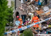Emergency workers at the scene of a suspected gas explosion, in which a young child was killed and two people were seriously injured, on Mallowdale Ave Heysham which caused 2 houses to collapse and badly damaged another. Picture date: Sunday May 16, 2021.