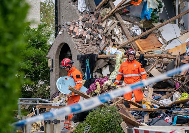 Emergency workers at the scene of a suspected gas explosion, in which a young child was killed and two people were seriously injured, on Mallowdale Ave Heysham which caused 2 houses to collapse and badly damaged another. Picture date: Sunday May 16, 2021.