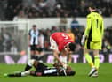 Manchester United's Harry Maguire checks on Newcastle United's Allan Saint-Maximin.