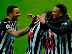 Newcastle's English midfielder Joe Willock (R) celebrates with teammates after scoring his team's first goal during the English Premier League football match between Newcastle United and Southampton at St James' Park in Newcastle-upon-Tyne, north east England on February 6, 2021.
