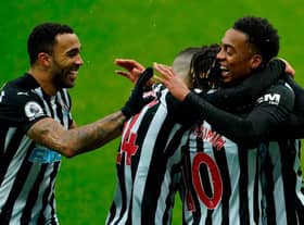 Newcastle's English midfielder Joe Willock (R) celebrates with teammates after scoring his team's first goal during the English Premier League football match between Newcastle United and Southampton at St James' Park in Newcastle-upon-Tyne, north east England on February 6, 2021.