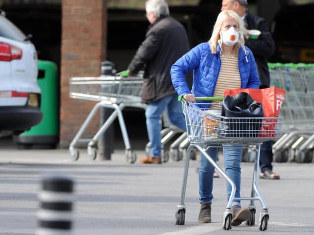 A shopper wears a protective mask at Boldon Colliery's Asda supermarket.