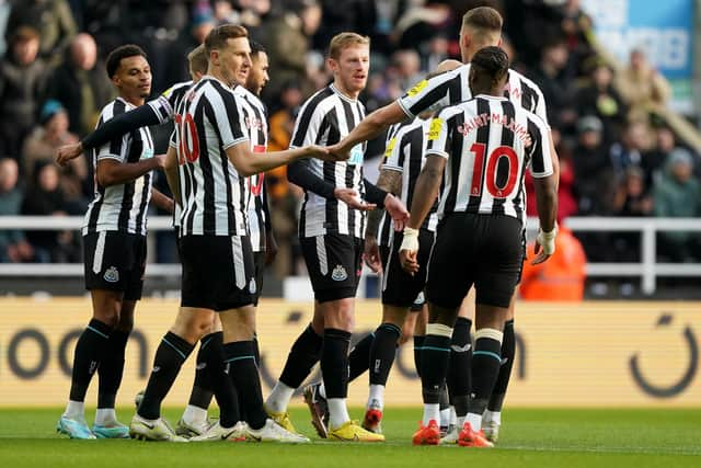 Newcastle United's Sean Longstaff, centre, elebrates scoring against Real Vallecano.