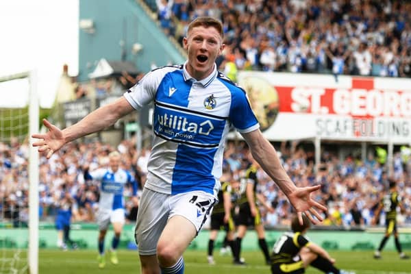 Elliot Anderson celebrates a scoring a promotion-winning goal for Bristol Rovers.