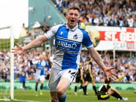 Elliot Anderson celebrates a scoring a promotion-winning goal for Bristol Rovers.