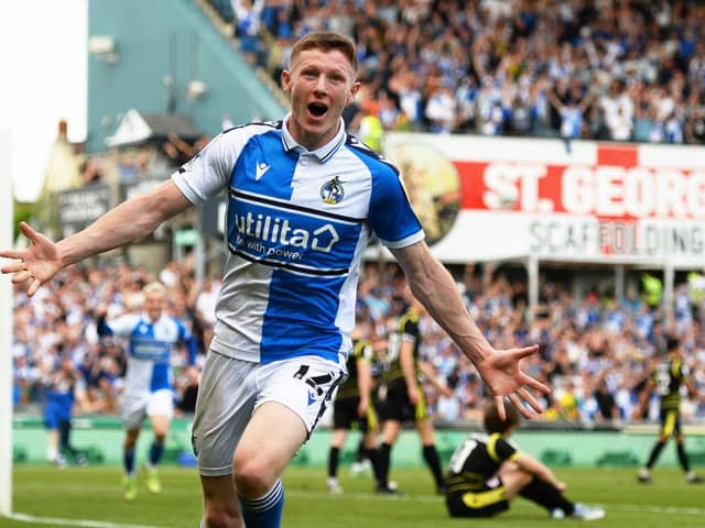 Elliot Anderson celebrates a scoring a promotion-winning goal for Bristol Rovers.