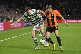 James Forrest and Mykhaylo Mudryk in action during a UEFA Champions League match between Celtic and Shakhtar Donetsk.