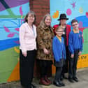 Maria Robinson (headteacher), Geri Mole (artist), Cllr Freda Geddes (l-r) with the mural