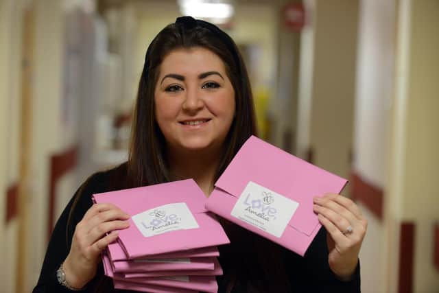 Steph Archbold with one of the welcome packs families are given through the work of Love, Amelia, with Mother's Day pamper gifts now being put together ahead of March 22.