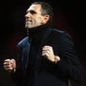 MANCHESTER, ENGLAND - JANUARY 22:  Gus Poyet the Sunderland manager celebrates after his team won 2-1 in the penalty shootout during the Capital One Cup semi final, second leg match between Manchester United and Sunderland at Old Trafford on January 22, 2014 in Manchester, England.  (Photo by Laurence Griffiths/Getty Images)