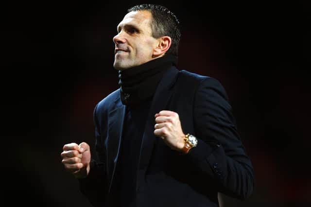 MANCHESTER, ENGLAND - JANUARY 22: Gus Poyet the Sunderland manager celebrates after his team won 2-1 in the penalty shootout during the Capital One Cup semi final, second leg match between Manchester United and Sunderland at Old Trafford on January 22, 2014 in Manchester, England. (Photo by Laurence Griffiths/Getty Images)