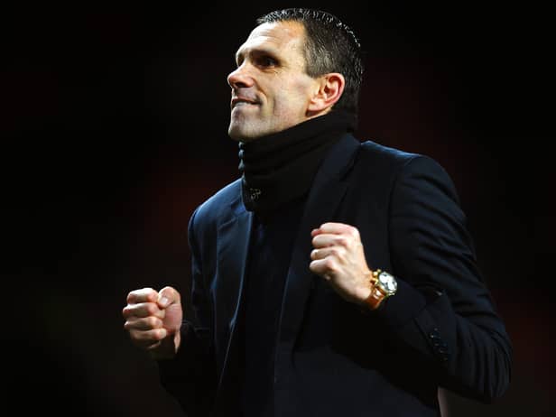 MANCHESTER, ENGLAND - JANUARY 22:  Gus Poyet the Sunderland manager celebrates after his team won 2-1 in the penalty shootout during the Capital One Cup semi final, second leg match between Manchester United and Sunderland at Old Trafford on January 22, 2014 in Manchester, England.  (Photo by Laurence Griffiths/Getty Images)