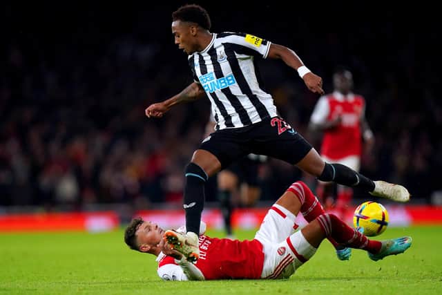 Arsenal's Ben White goes down whilst battling for the ball against Newcastle United's Joe Willock.