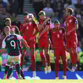 Scotland's Leigh Griffiths scores a free kick during their last game against England; a 2-2 draw at Hampden Park in 2017. PA image.