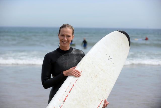 Ashley Cave enjoys a surf in the sun at Sandhaven beach