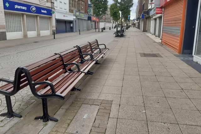 Empty benches, which would normally be full of people enjoying a coffee and a chat, captured the sombre mood of a town in mourning.