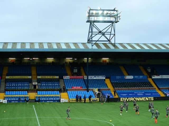 KILMARNOCK, SCOTLAND - NOVEMBER 01: General view inside the stadium as Rangers players warm up prior to the Ladbrokes Scottish Premiership match between Kilmarnock and Rangers at Rugby Park on November 01, 2020 in Kilmarnock, Scotland. Sporting stadiums around the UK remain under strict restrictions due to the Coronavirus Pandemic as Government social distancing laws prohibit fans inside venues resulting in games being played behind closed doors. (Photo by Mark Runnacles/Getty Images)