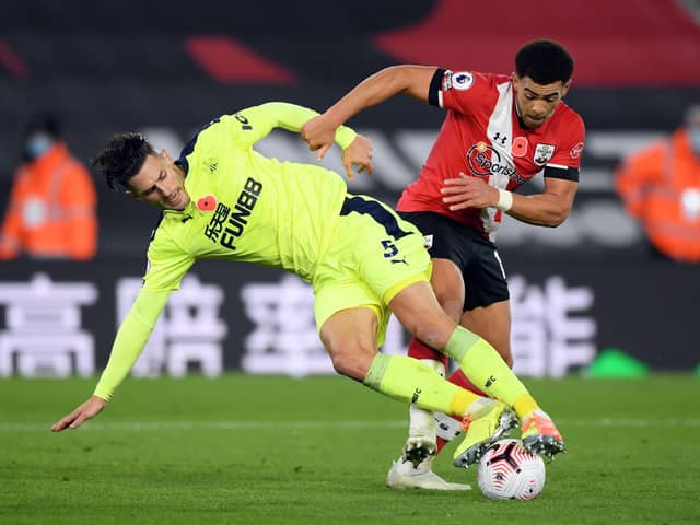 Southampton's English midfielder Che Adams (R) vies for the ball against Newcastle United's Swiss defender Fabian Schar (L) during the English Premier League football match between Southampton and Newcastle United at St Mary's Stadium in Southampton, southern England on November 6, 2020. (Photo by Stu Forster / POOL / AFP) / RESTRICTED TO EDITORIAL USE. No use with unauthorized audio, video, data, fixture lists, club/league logos or 'live' services. Online in-match use limited to 120 images. An additional 40 images may be used in extra time. No video emulation. Social media in-match use limited to 120 images. An additional 40 images may be used in extra time. No use in betting publications, games or single club/league/player publications. /  (Photo by STU FORSTER/POOL/AFP via Getty Images)