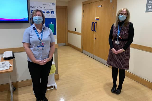 Carol Cook, a library assistant, and Catherine Fisher, head of library service, have volunteered to man the vaccine check-in for the trust at its clinic in Sunderland.