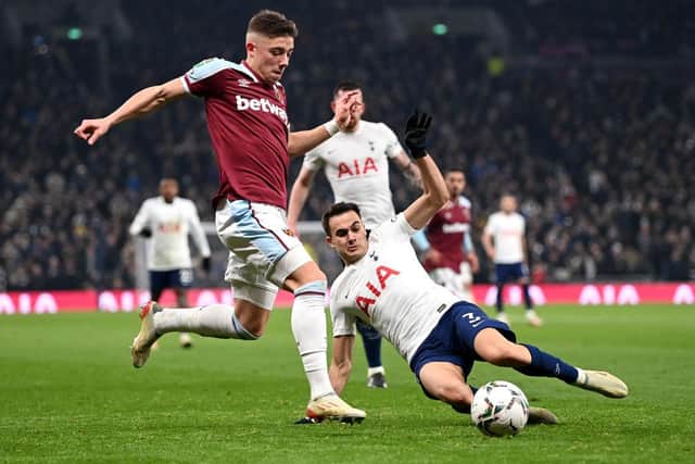 Harrison Ashby of West Ham United is challenged by Sergio Reguilon of Tottenham Hotspur during the Carabao Cup Quarter Final match between Tottenham Hotspur and West Ham United at Tottenham Hotspur Stadium on December 22, 2021 in London, England. (Photo by Shaun Botterill/Getty Images)