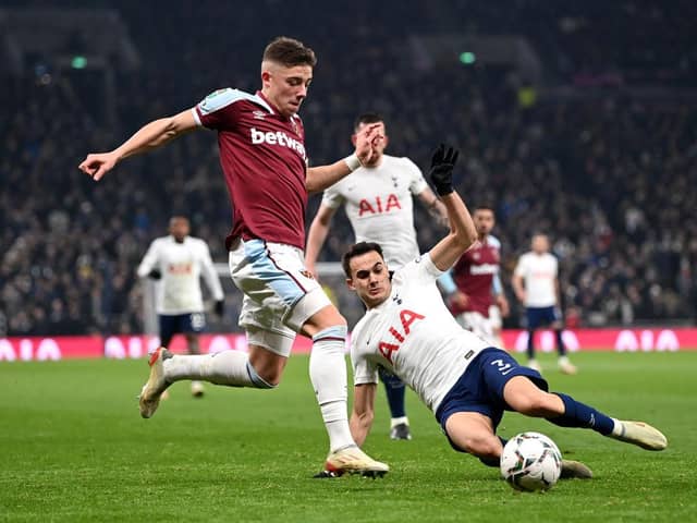 Harrison Ashby of West Ham United is challenged by Sergio Reguilon of Tottenham Hotspur during the Carabao Cup Quarter Final match between Tottenham Hotspur and West Ham United at Tottenham Hotspur Stadium on December 22, 2021 in London, England. (Photo by Shaun Botterill/Getty Images)