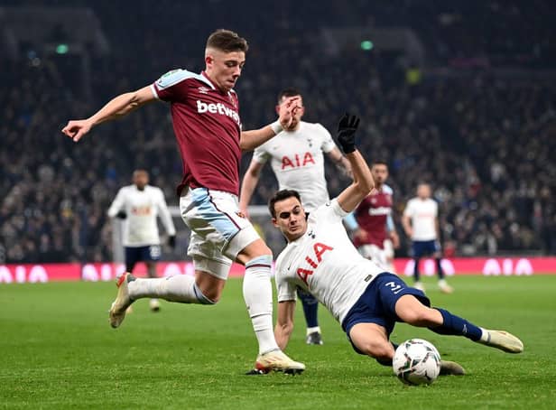 Harrison Ashby of West Ham United is challenged by Sergio Reguilon of Tottenham Hotspur during the Carabao Cup Quarter Final match between Tottenham Hotspur and West Ham United at Tottenham Hotspur Stadium on December 22, 2021 in London, England. (Photo by Shaun Botterill/Getty Images)
