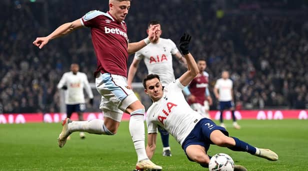 Harrison Ashby of West Ham United is challenged by Sergio Reguilon of Tottenham Hotspur during the Carabao Cup Quarter Final match between Tottenham Hotspur and West Ham United at Tottenham Hotspur Stadium on December 22, 2021 in London, England. (Photo by Shaun Botterill/Getty Images)