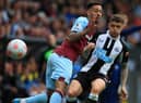 Newcastle United's English defender Kieran Trippier (R) vies with Burnley's English midfielder Dwight McNeil (L) during the English Premier League football match between Burnley and Newcastle United at Turf Moor in Burnley, north west England on May 22, 2022. (Photo by LINDSEY PARNABY/AFP via Getty Images)