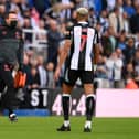 Club doctor Paul Catterson runs to the East Stand with a defibrilator.