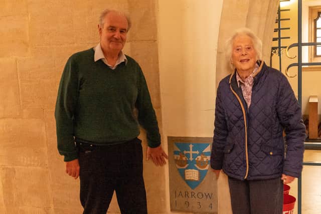 Historian Tom Tweddell with Tessa Preece, granddaughter of John Jarvis beside the Jarrow Stone in Guildford Cathedral.
