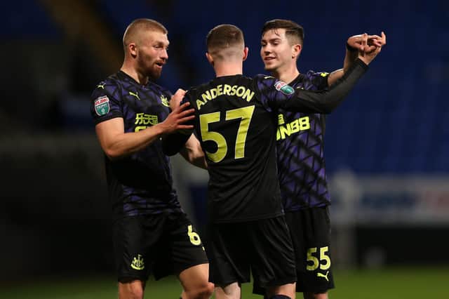 BOLTON, ENGLAND - NOVEMBER 17: Elliot Anderson of Newcastle United U21's celebrates his second goal with teammates during the EFL Trophy match between Bolton Wanderers and Newcastle United U21 at University of Bolton Stadium on November 17, 2020 in Bolton, England.