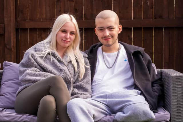 Kai Heslop at home with girlfriend Nicole Hughes following the surgery. Photo by Steven Lomas.