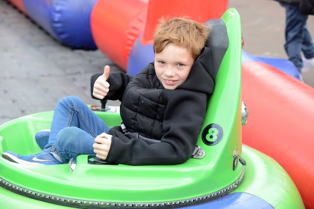 A thumbs up from Dylan Key, eight, as he enjoys the fun at Ocean Beach Pleasure Park.