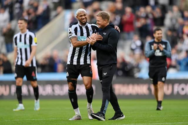 Joelinton of Newcastle United celebrates victory with Eddie Howe, Manager of Newcastle United following the Premier League match between Newcastle United and Brentford FC at St. James Park on October 08, 2022 in Newcastle upon Tyne, England. (Photo by Stu Forster/Getty Images)