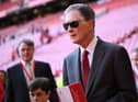 Liverpool's US owner John W. Henry leaves his seat after the English Premier League football match between Liverpool and Bournemouth at Anfield in Liverpool, north west England on August 27, 2022. - Liverpool won the game 9-0. (Photo by OLI SCARFF/AFP via Getty Images)