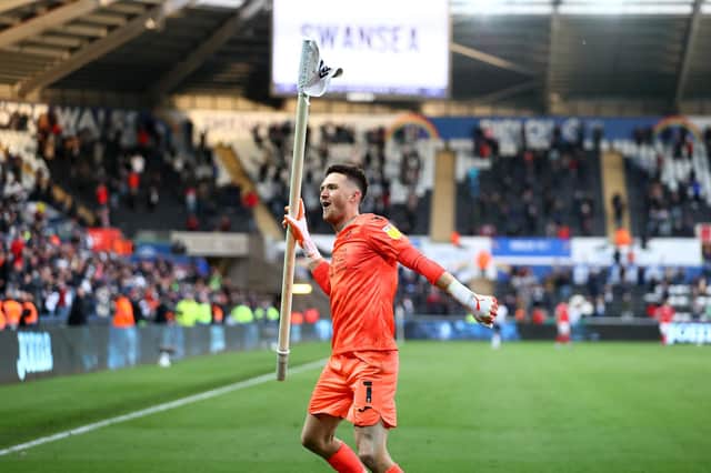 Freddie Woodman of Swansea City celebrates at full time following the Sky Bet Championship Play-off semi-final second leg match between Swansea City and Barnsley at Liberty Stadium.