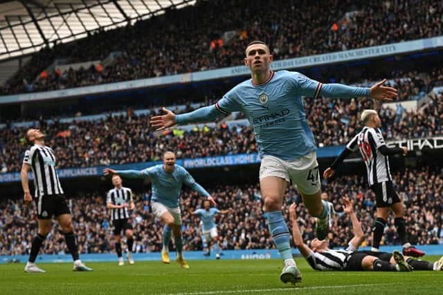 Manchester City midfielder Phil Foden celebrates after scoring the opening goal.