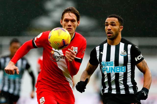 Southampton's Jannik Vestergaard (L) vies with Newcastle United's Callum Wilson during the English Premier League football match between Newcastle United and Southampton at St James' Park in Newcastle-upon-Tyne, north east England on February 6, 2021.