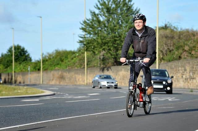 Cyclist Jonathan Barlow using the cycle lanes around The Arches, Tyne Dock.