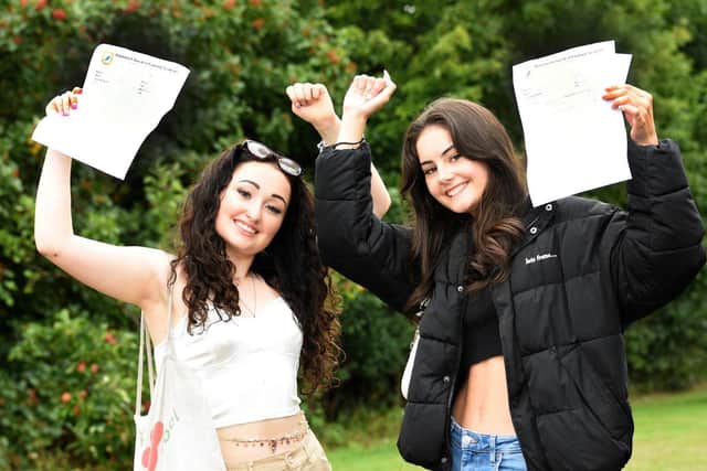 Whitburn Church of England Academy pupils Abigail Boyce, 16, and Harriet Scott, 16, celebrate their GCSE results.