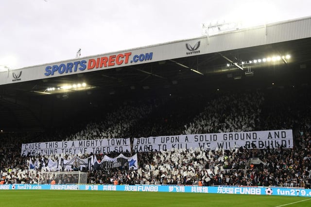 A Wor Flags display ahead of the Tottenham Hotspur match following the takeover reading the lyrics from the Jimmy Nail song 'Big River': 'Cause this is a mighty town, built upon solid ground, and everything they've tried so hard to kill, we will rebuild!'