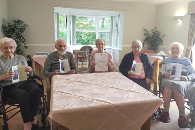 Joy for the Hebburn Manor residents as they hold their letter from the Queen.