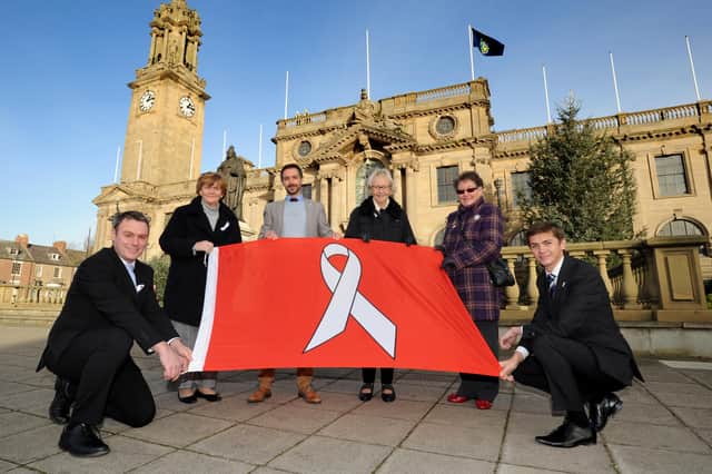South Tyneside Council chief executive Jonathan Tew, director of public health Tom Hall, and Cllr Adam Ellison, join council leader Cllr Tracey Dixon, Cllr Anne Hetherington and Cllr Ruth. Berkley to raise the White Ribbon flag.