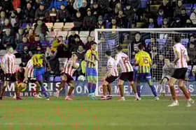 Dan Udoh scores the equaliser for Shrewsbury